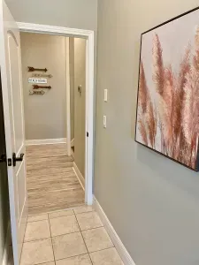 this hall leads to the loft bedrooms up some stairs on the right and around the corner to the game room that has a trundle