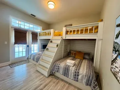the bunk room is perfect for sleepovers with 2 full mattresses and 2 twins. there is a bathroom that is accessible from the hall but can also be enclosed within this room by closing the door in the hallway