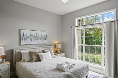 this bedroom has a king bed and access to the attached bathroom from within the bedroom and also from the hallway