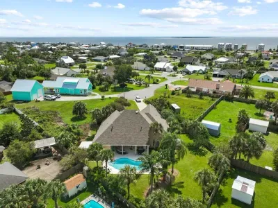 Two blocks to the beach. Either walk and use the provided pull cart or use the provided golf carts. The rental comes with a 6 seater and 4 seater golf cart and all the beach gear you will need.