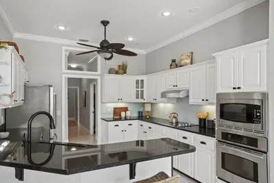 the kitchen has lots of cooking accessories