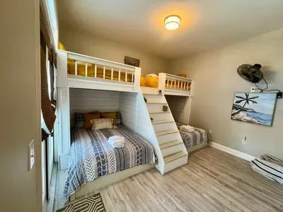 the bunk room is perfect for sleepovers with 2 full mattresses and 2 twins. there is a bathroom that is accessible from the hall but can also be enclosed within this room by closing the door in the hallway