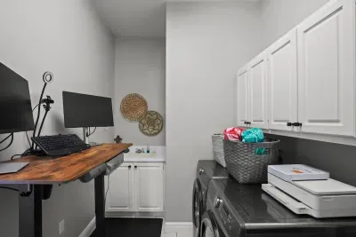 laundry room with a desk that can be rolled out and into any room