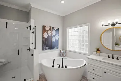 the master bathroom is large with 2 walk in closets in between the master bedroom and bathroom