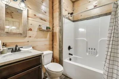 Main floor bathroom outside of bedroom 2 and shared with family room