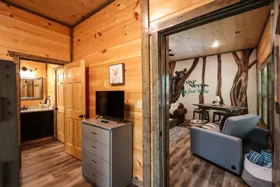 View from bunkroom into both the full bathroom and gameroom/movie room
