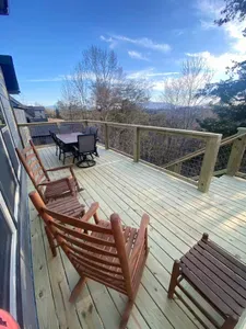 Brand new deck outside of family room with seating and eating area