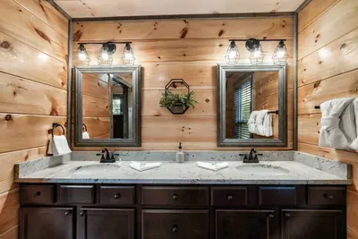 Master attached bathroom with double sink and stand up shower