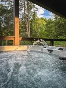 Lower level outdoor 6 person hot tub with outdoor TV