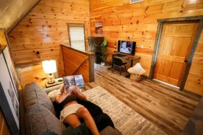 Loft area with cozy loveseat and full desk area