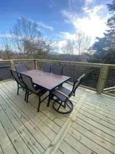Brand new deck outside of family room with seating and eating area