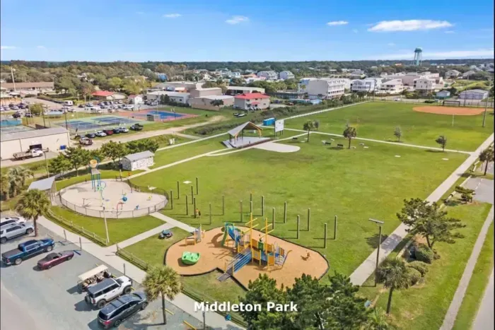 Middleton Park is a public park nearby with a splashpad, playground, amphitheater with live music in the summer, and large parking area across form the beach.