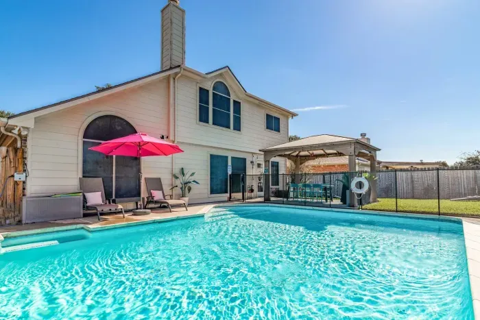 Backyard Pool with Flamingos
