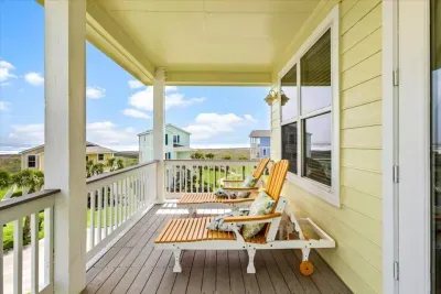 Kick back in the shade with a book or a drink (or both) - this breezy porch is made for laid back island living. 
