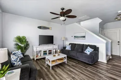 Another view of the living area - sunny and spacious, just steps from the deck and ocean breeze. 