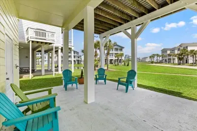This coastal retreat offers grassy space for play and plenty of room to gather outside. 