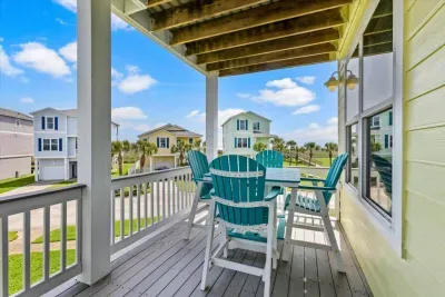 Start your day with a fresh cup of coffee or unwind in the evening with a glass of wine as you take in relaxing ocean views and the soothing sound of waves from just beyond the boardwalk.