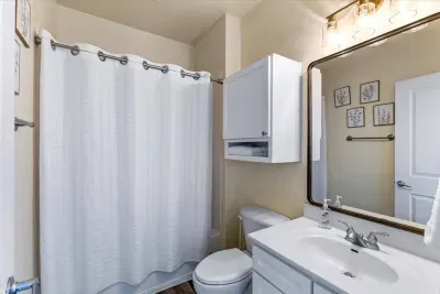 Thoughtfully designed and family-friendly, this bathroom features a full tub and plenty of space. 