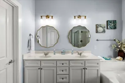Dual vanities and a spa tub make this bathroom a luxurious retreat for parents or grandparents. 