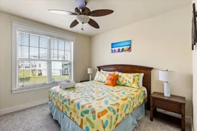 Bright and cheery king bedroom with beachy vibes - perfect for teens, couples, or grandparents. 