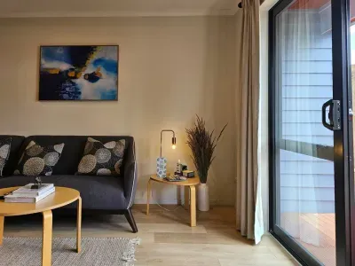 Enjoy your spot the comfy sofa, Plenty of natural light, good indoor-outdoor flow. Double glazing and air conditioning for ultimate comfort.