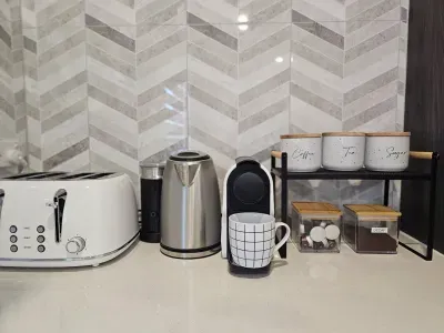 We've got everything you need for a relaxing stay, including a Nespresso machine with milk frother, coffee, decaf, tea, and all the essentials stocked for your arrival.