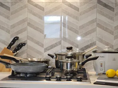 Fully equipped kitchen! Gas stove, Oven, pots & pans, rice cooker & everything you need to whip up feasts. Dishwasher + fridge/freezer for easy cleanup.