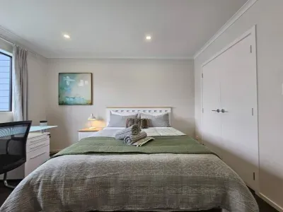 Enhance your retreat with dedicated workspaces for productivity and complementing your super comfy queen beds. Enjoy the convenience of double wardrobes, hangers, and a tower fan for added comfort .