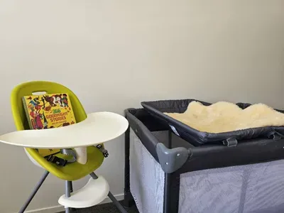 Highchair, cot and children's book, perfect for families traveling with little ones.