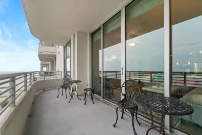 Private balcony with sweeping panoramic views of the coastline designed for sunrise coffee moments and sunset unwinding.