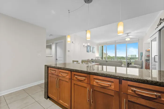 Contemporary kitchen with bar seating and elegant pendant lighting.