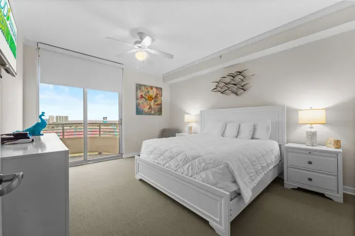 Serene primary bedroom with soft tones and hotel-style comforts.