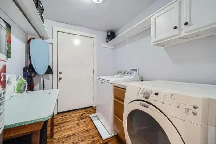 A well-stocked laundry room with detergent, dryer sheets, and space to fold.