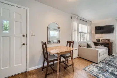 A cozy dining area to enjoy meals, games, or a glass of wine together.