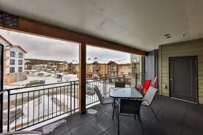 An expansive private balcony with striking views and luxurious outdoor seating.