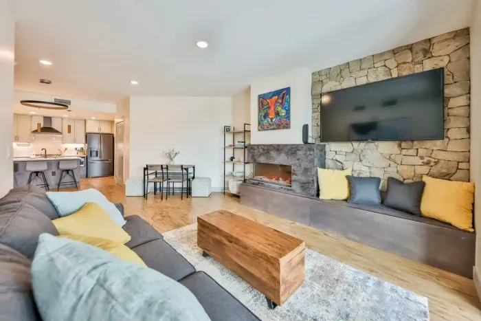 A comfortable spot to relax with upscale furnishings and sunlit alpine views.