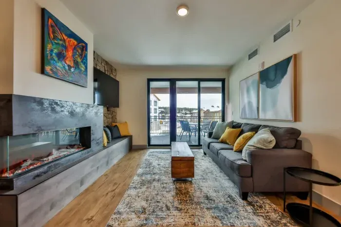 Charming living room bathed in natural light, offering an inviting and elegant place to gather.