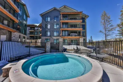 2. Indulge in a relaxing outdoor hot tub experience surrounded by breathtaking alpine scenery.
