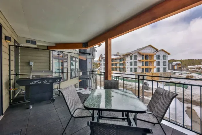 A spacious, elegantly furnished balcony perfect for serene mornings or evening relaxation.