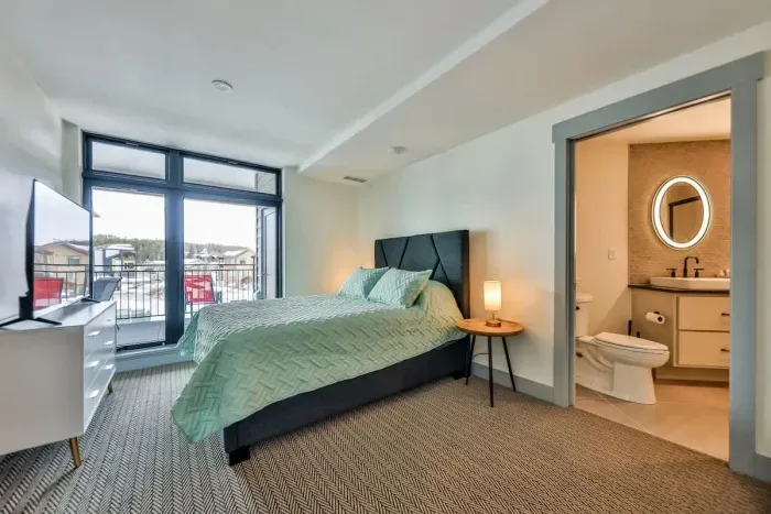 5. Retreat to a luxurious master suite designed for serene mountain mornings and peaceful rest.