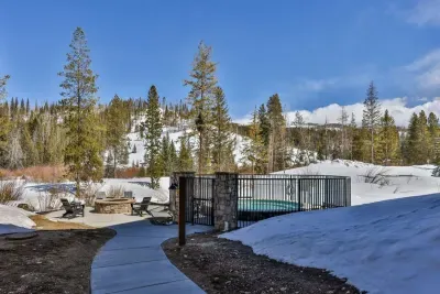 A serene pathway leading to the outdoor fire pit surrounded by breathtaking scenery.