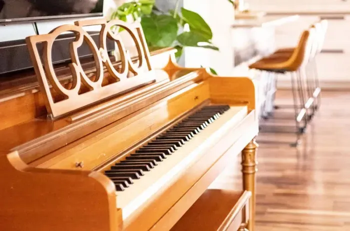Discover the cool piano, adding a touch of elegance and charm to the space. Whether you're a music lover or simply appreciate the aesthetic, it's the perfect feature for relaxation or inspiration.