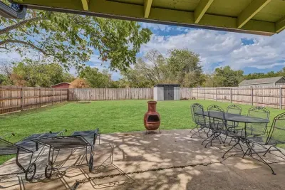 Private patio with lush plants and a calming atmosphere, perfect for unwinding after a long day.