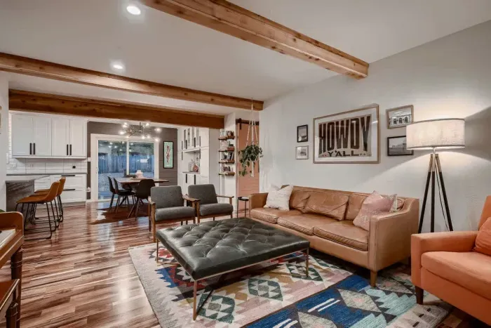Open-concept living room with seamless flow to the kitchen and dining areas.
