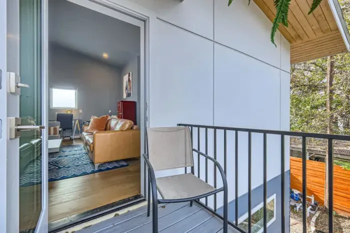 A cozy urban retreat with a balcony to enjoy the vibrant sights and sounds of the city.