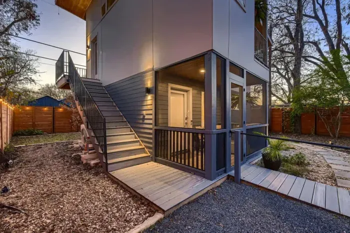Warmly lit exterior at dusk showcasing the home’s modern architecture and inviting atmosphere.
