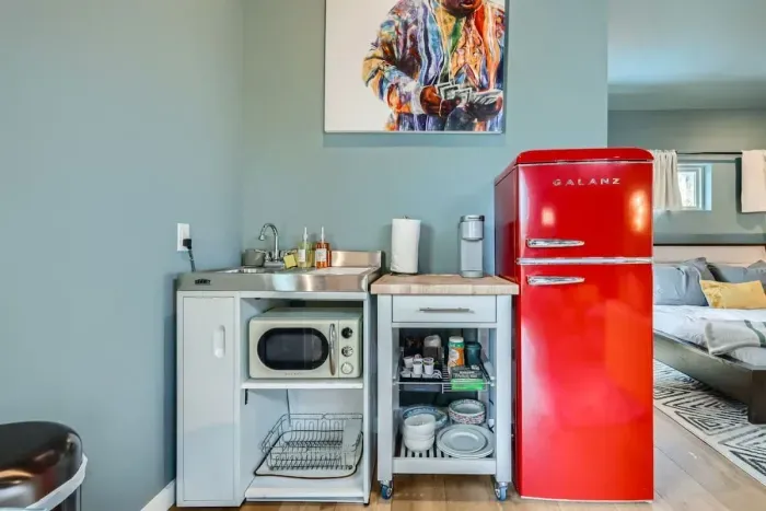 Minimalist design meets functionality in this charming kitchenette