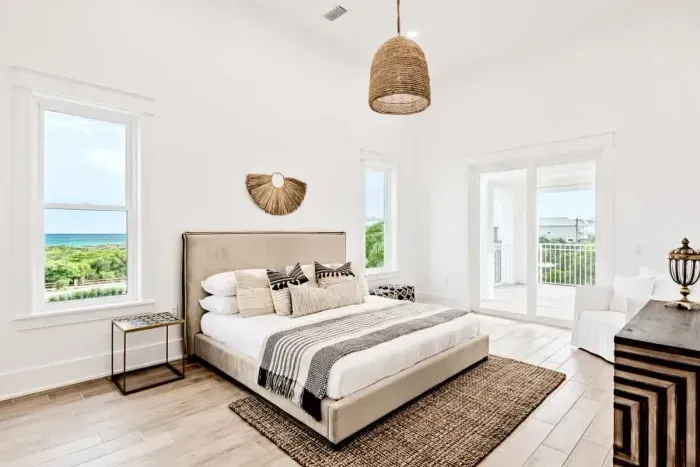 Natural light floods this charming room, complete with a queen-size bed and stylish furniture, making it the perfect spot for a peaceful stay.
