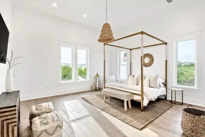 Wake up refreshed in this serene bedroom featuring a dreamy four-poster bed, layered with natural textures and soothing earthy hues