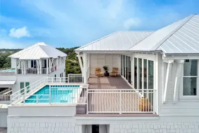 Serenity meets style featuring a stunning pool and cozy seating.